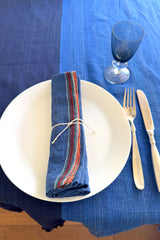 HL_Aegean_Royal_Blue_Napkin on tabletop with blue drinking glass