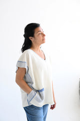 Ivory Blue Tribeca Short V Neck Tunic on model in jeans
