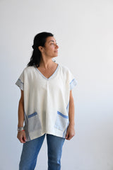 Ivory Blue Tribeca Short V Neck Tunic on model in blue jeans